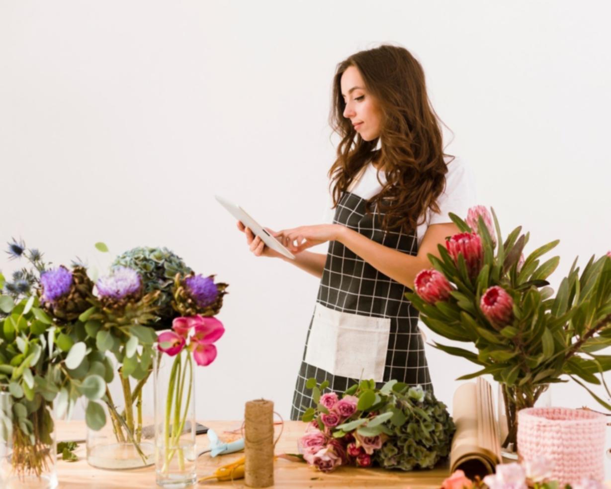 Students working with seasonal flower materials